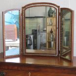 A freestanding three sectional tryptic mirror.