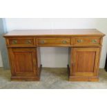 A large mahogany three drawer sideboard,