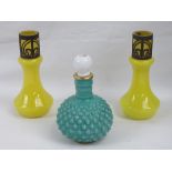 A dimpled green glass bottle with stopper,