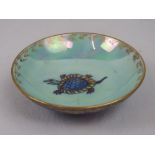 A Wedgwood Fairy Lustre dish decorated with a turtle, 9.5cm diameter.