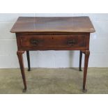 An elm top single drawer lowboy raised over square cut legs, 81cm wide.