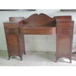 A fine break front Georgian mahogany buffet sideboard, central barrel fronted drawer,