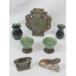 A Chinese green jade two handled vase and cover pierced and carved with figures, 16cm high,