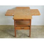 A c1930s oak four way drop leaf occasional table with single drawer under, raised over square legs,