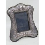 A HM silver photograph frame having repoussé bluebell design in the Art Nouveau style,