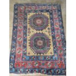 A blue and cream ground small rug with geometric decoration, 140 x 98cm.