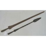 Two iron spear heads measuring 54cm and 72cm respectively.