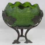 A green glass handkerchief bowl of caul form raised over a pierced foliate base, 21cm dia.