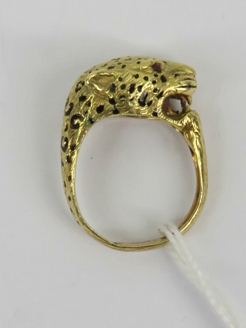 An unusual 18ct gold leopards head ring having black enamel spots and faceted garnet eyes, - Image 2 of 2