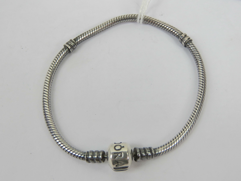 A silver Pandora charm bracelet having 925 hallmarked snake link chain and 'bead' clasp marked