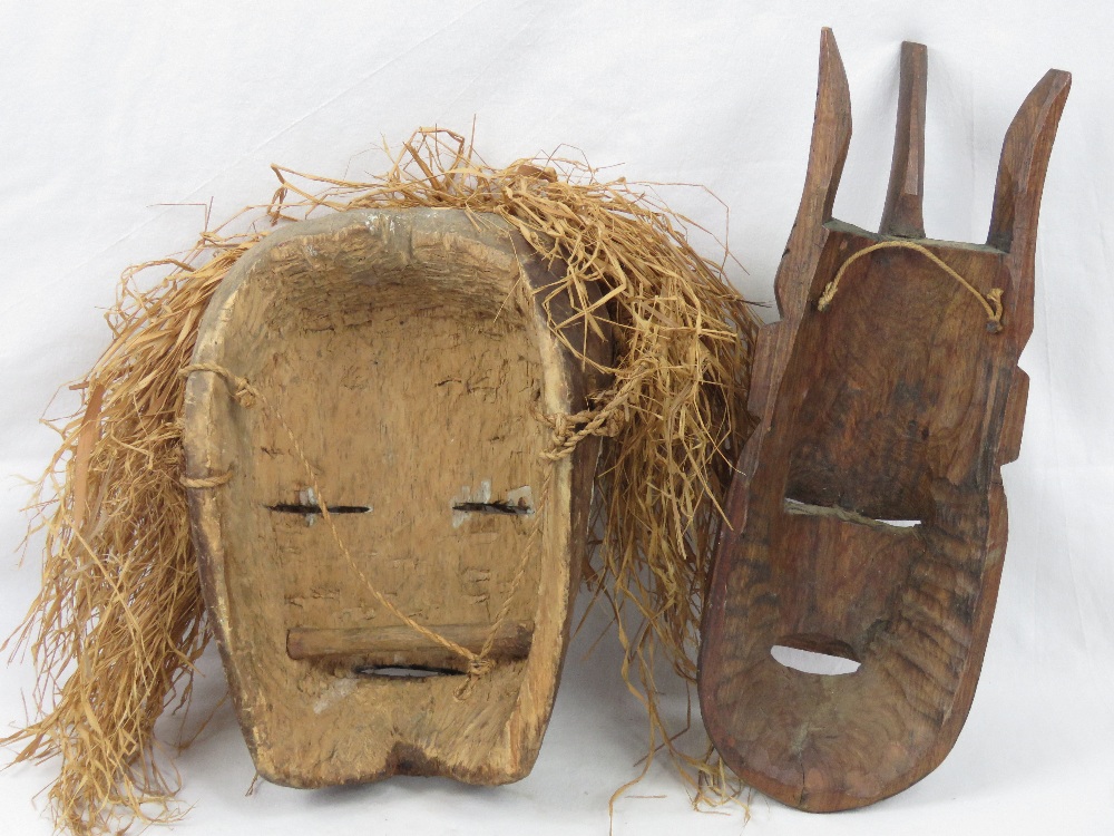 A 20th century African tribal mask painted in whites, blacks and red, having grass 'hair, - Image 2 of 2