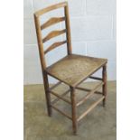 A single elm seated Lancashire ladderback chair.