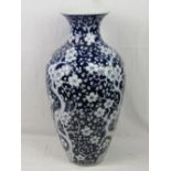 A large late 19th/early 20thC Chinese blue and white ovoid vase decorated in underglaze blue with