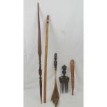 A quantity of ethnic items including; a large cone, a cane flute,