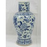 A Chinese blue and white baluster vase handprinted with birds an flowering branch within key