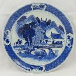 A Chinese blue and white charger, hand painted with landscape and figure decoration, 31cm diameter.