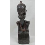 A well carved wooden bust of an African gentleman having headpiece and necklace, 43cm high.