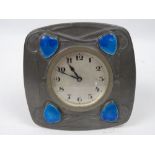 A good Tudric Pewter Art Nouveau wind up desk clock having silvered dial with Arabic numerals,