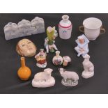 A Staffordshire pottery recumbent sheep, fairing figures, etc.