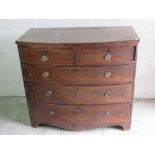 A barrel fronted chest of two short over three long mahogany drawers, 105cm wide.