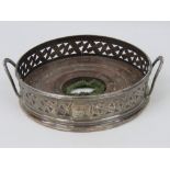 A HM silver wine coaster having wooden baise covered base (baise a/f) with pierced floral gallery