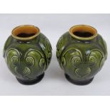 A pair of small Linthorpe Pottery globular vases designed by Dr Christopher Dresser,