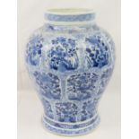 A 19thC Chinese blue and white tapered ovoid vase hand painted with multiple panels of flowering