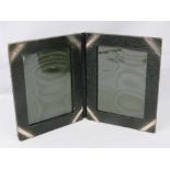 A leather bound folding photograph frame,