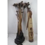 A quantity of assorted vintage gold clubs, most with hickory shafts, including drivers, wedges,