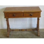 A Victorian pine pier table raised over four turned column supports, twin frieze drawers, 98cm wide.