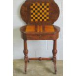 A superb 19th century walnut fold over games table having inset chess/draughts,