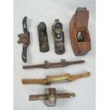 A quantity of plains, spoke shaves, and a fine quality mahogany and brass marking gauge.