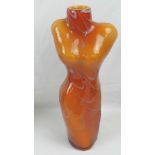 A tall vase in the form of a female torso, orange ground, all standing 44cm high.