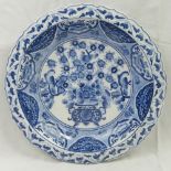 A Chinese blue and white circular dish with everted waves border, painted with birds,