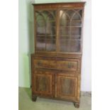 A fine secretaire bookcase, pediment top over twin glazed doors,