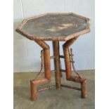 A Victorian bamboo octagonal occasional table having hand painted Oriental top (top a/f), 67cm dia.