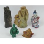 Two carved stone Oriental figurines, each standing 9cm high.