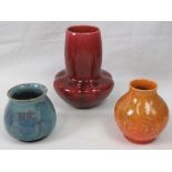 A Royal Lancastrian red glazed vase of squat moulded form, shape number 2783, 16cm high,