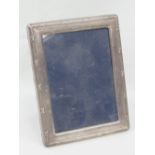 A contemporary HM silver photograph frame complete with glass,