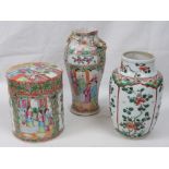 A late 19thC Cantonese famille rose cylindrical jar and cover, decorated with figures on a terrace,