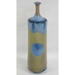 A studio pottery vase of cylindrical form with slender stem neck,