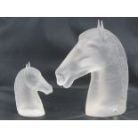 Two Swedish crystal horse heads standing 13cm and 24cm respectively.