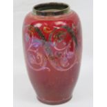 A Pilkington Royal Lancastrian flambe lustre vase of ovoid design with scroll and leaf sprig