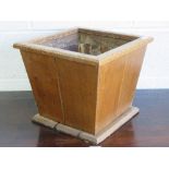 A c1930s heavy oak square shaped planter having metal liner, 37cm square.