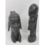 A well carved ebony bust of an African female having extended ears and red hair piece, 20cm high.