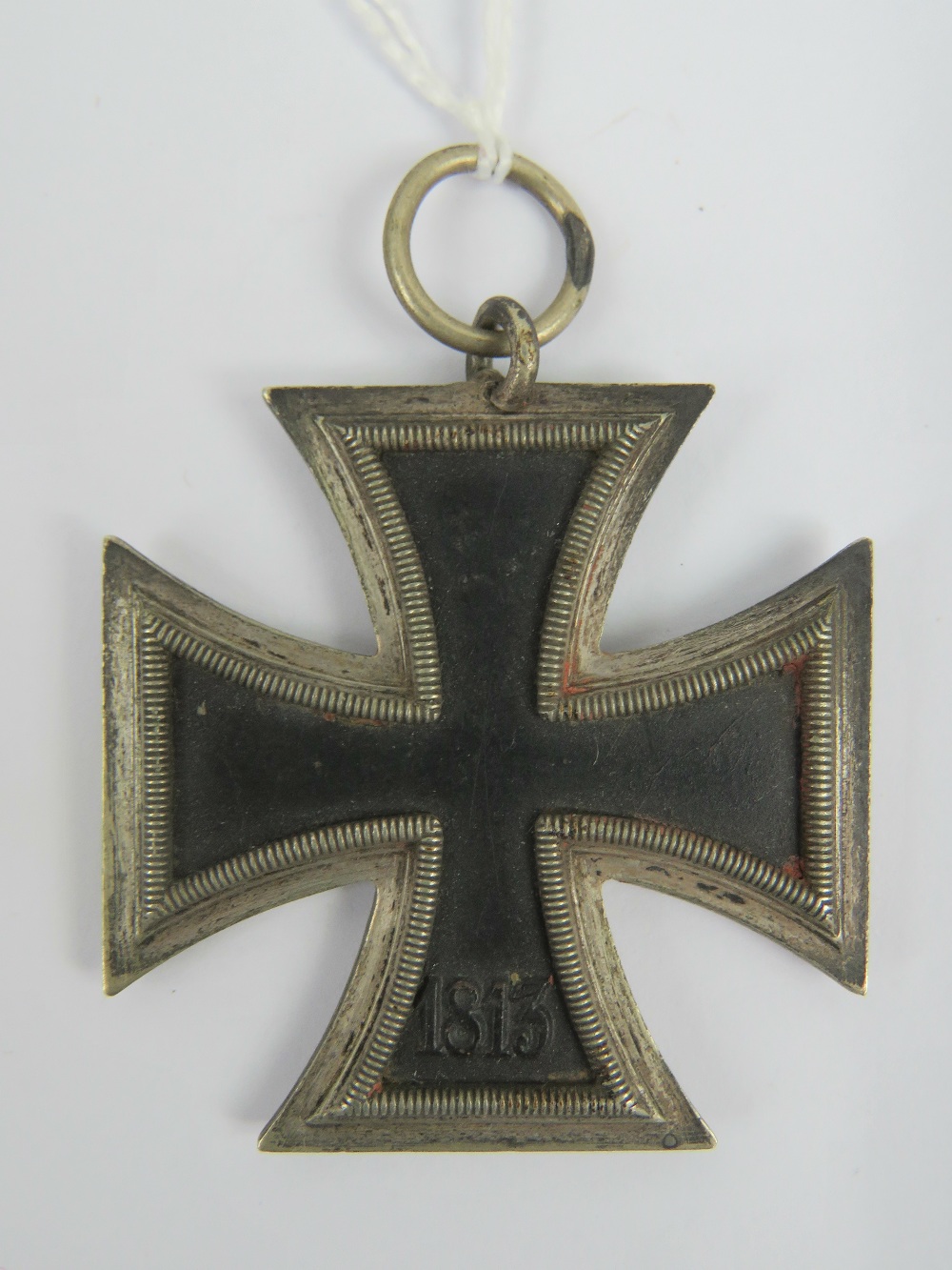 A WWII German Iron Cross medal, together with a photo postcard of Hitler. Two items. - Image 3 of 3