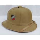 A WWII German Afrika Corp Luftwaffe pith Tropic helmet having two decals upon,