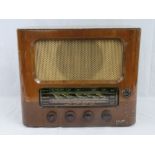 A Royal Engineers Officers Mess radio by Marconi radio having electrical test certification sticker