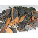 A quantity of assorted Police and Military pistol holsters including Browning high power and