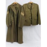 A Royal Mechanical and Electrical Engineers Officers overcoat with tunic and matching trousers.